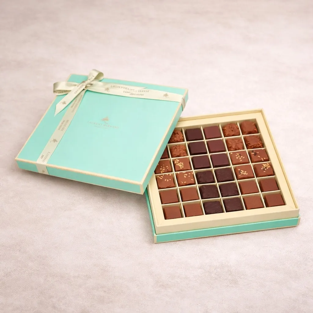 Luxury 36-piece artisan chocolate box by Laurent Bernard Chocolatier, featuring handcrafted assorted pralines in an elegant turquoise and gold gift box, premium chocolate gift with delivery in Singapore.