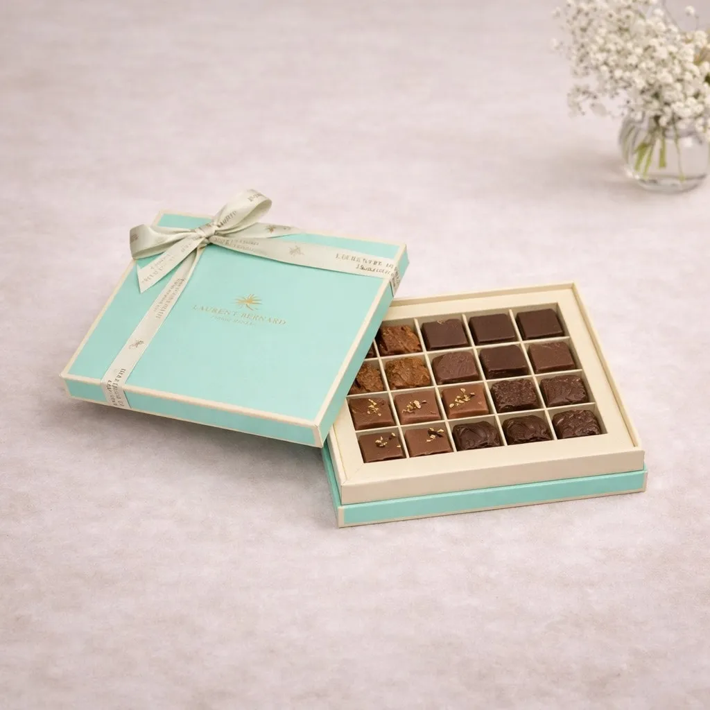 Luxury 16-piece artisan chocolate box by Laurent Bernard Chocolatier in an elegant turquoise gift box.