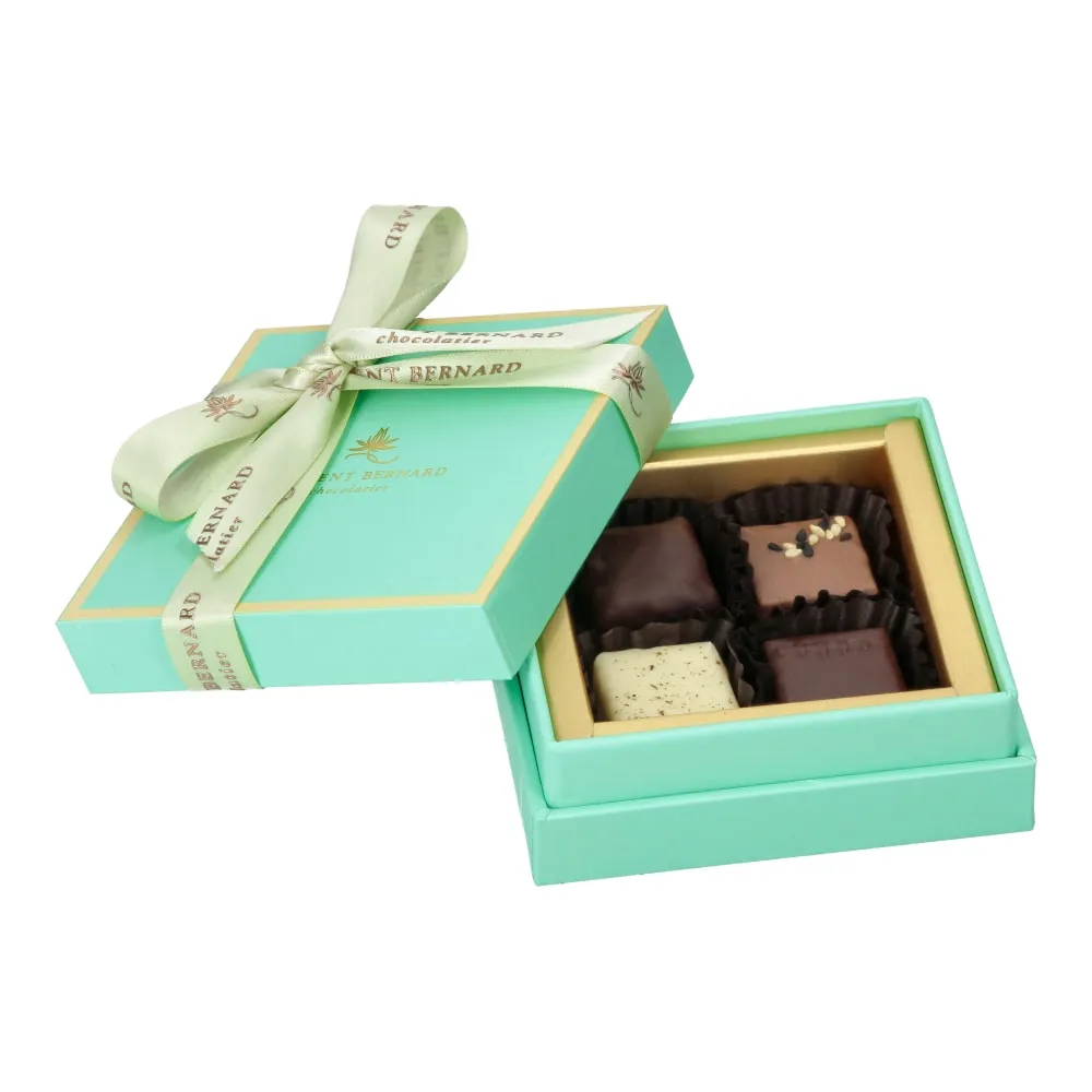 Luxury turquoise chocolate box with ribbon premium-confectionery packaging.