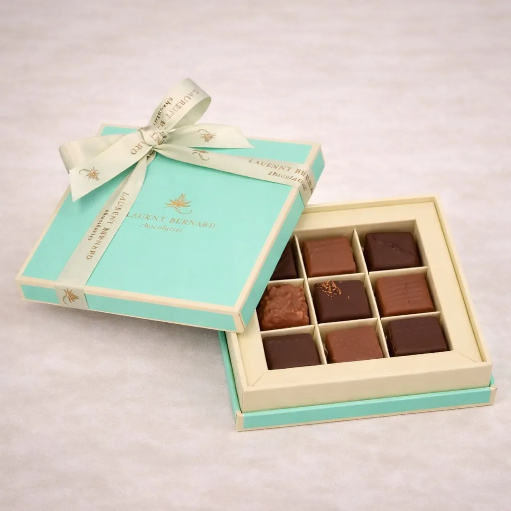 Luxury artisan chocolate gift box by Laurent Bernard Chocolatier, featuring handcrafted assorted pralines in an elegant turquoise and gold box, premium chocolate gift for Valentine’s Day and special occasions in Singapore.