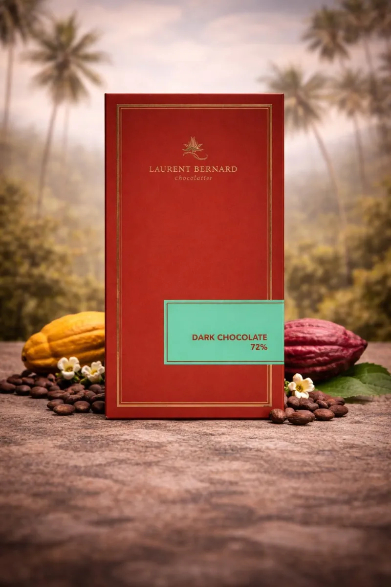 Luxury Laurent Bernard dark chocolate bar styled with cocoa pods, tropical palms, evoking origin and craftsmanship. Singapore delivery.