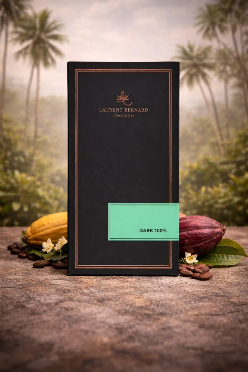 Laurent Bernard cacao paste bar displayed on a tropical cacao background with palms, cocoa pods and artisan stone surface. delivery in Singapore.